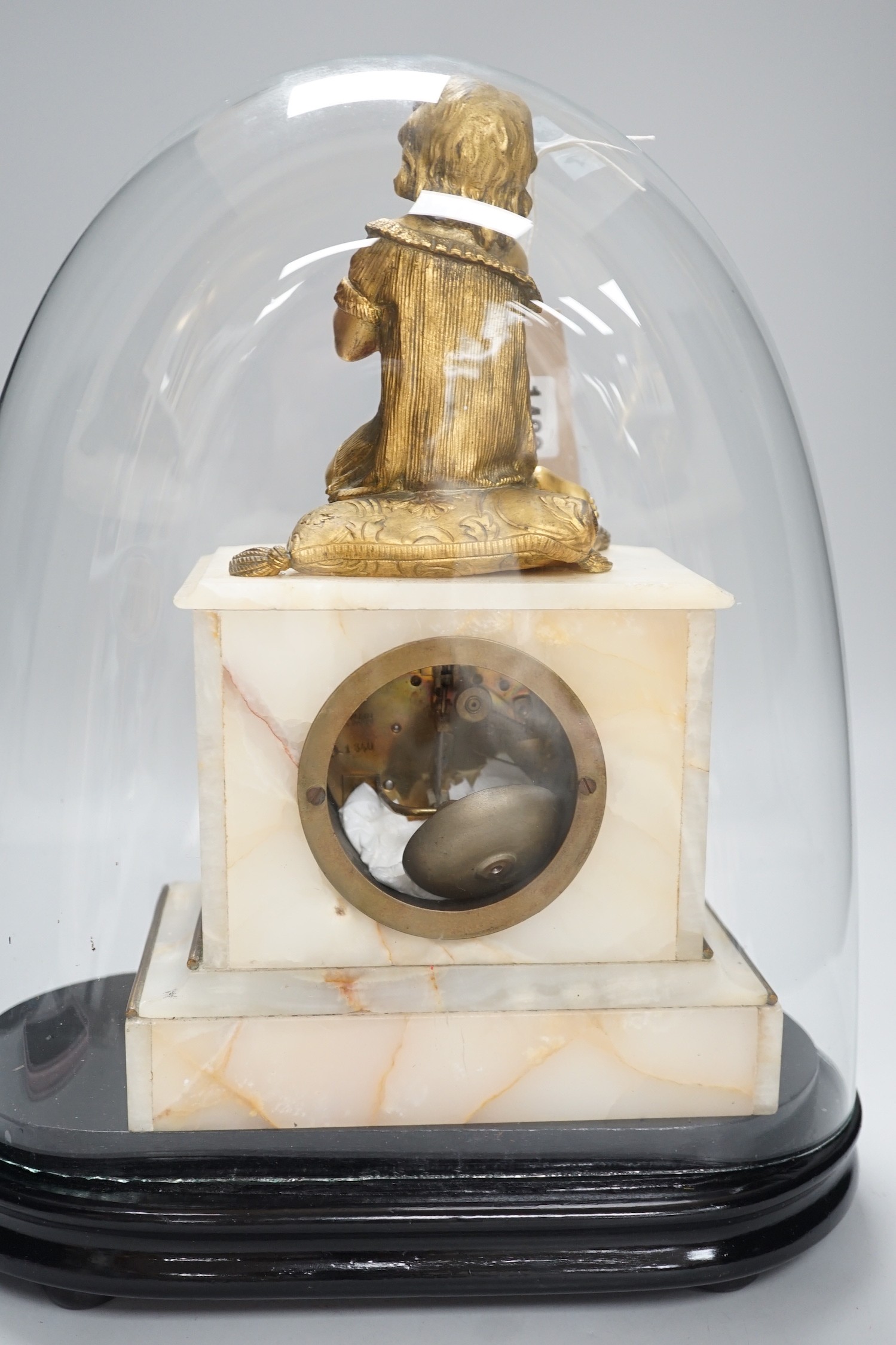 A 19th century ormolu and alabaster mantel clock under glass dome. 39cm tall